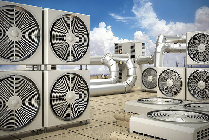 shiny metal hvac system on roof of building